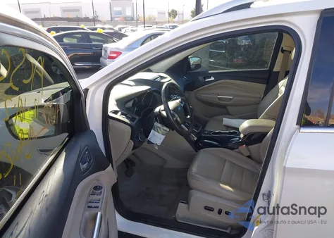 2014 Ford Escape Titanium z USA, uszkodzony, nr VIN 1FMCU9J92EUB16573